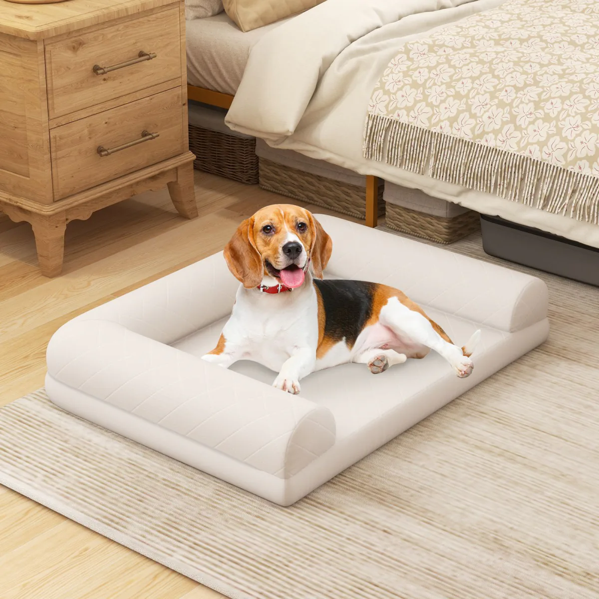 Beige foam bolster dog bed on a rug beside a bed, with a beagle lying on it