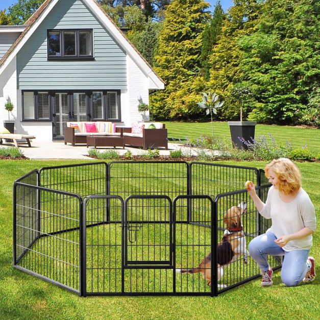 Black eight-panel pet playpen in a garden
